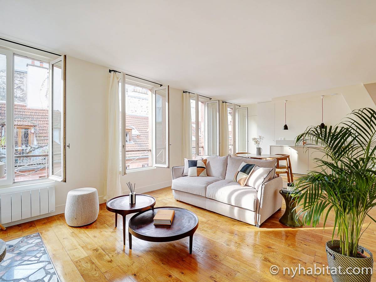 Open the wraparound windows of this Bastille alcove studio to flood the space with Paris’s summer air. (Rental ID: PA-4399)