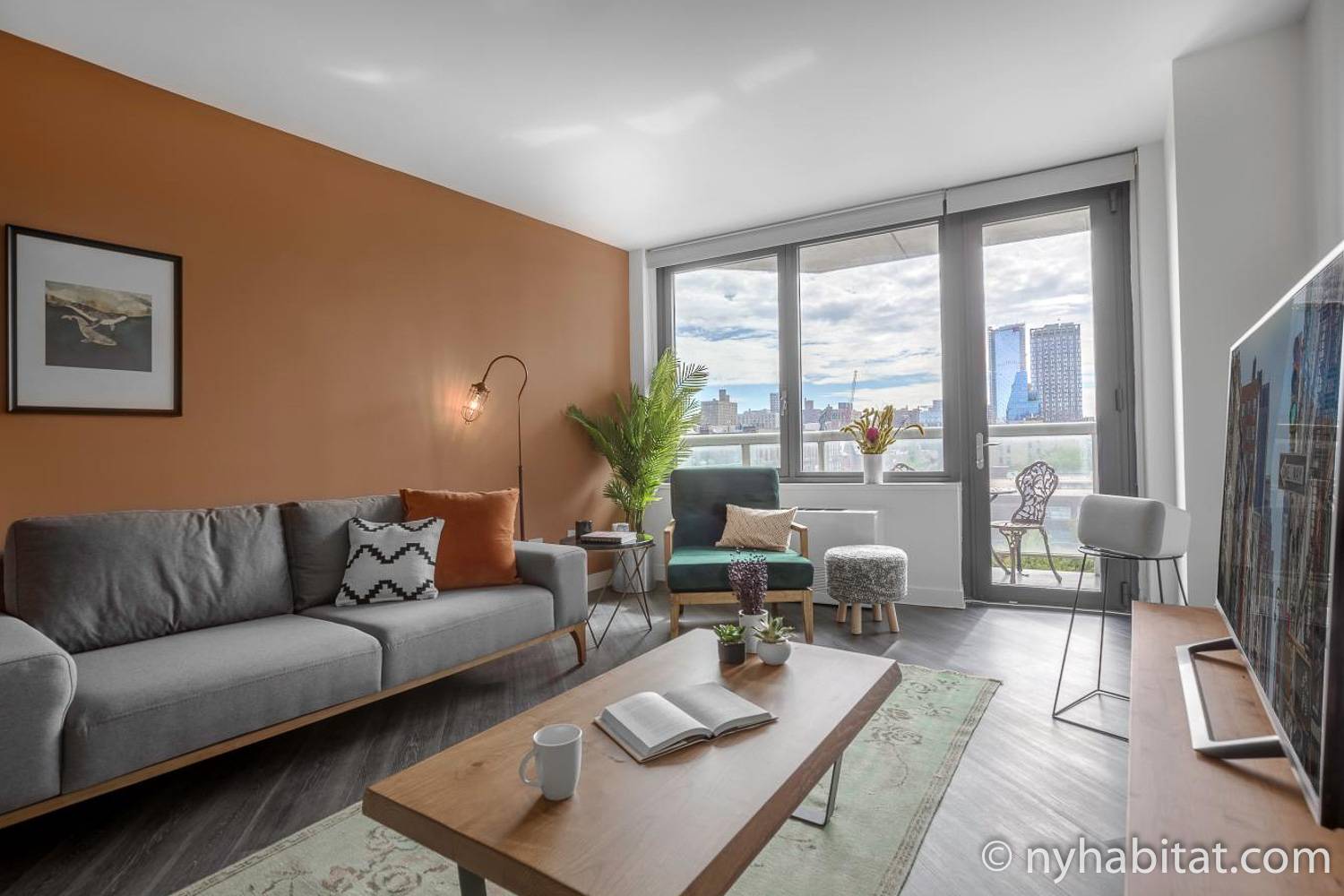 Image of living area of NY-17720 with sofa, coffee table, and armchair.