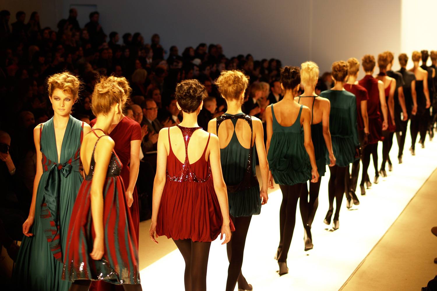 Image of models walking on a runway during a New York Fashion Week runway show.