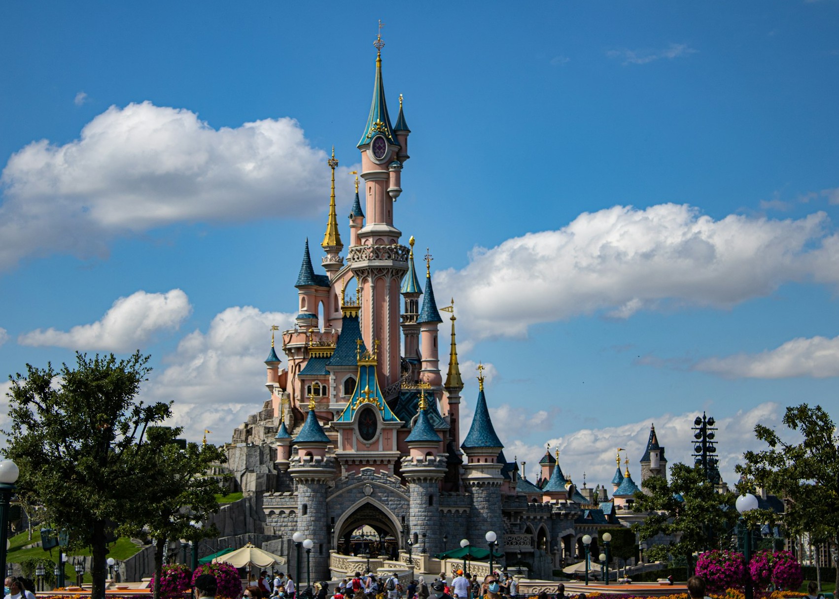 Take a day trip with the family to Disneyland in Paris and experience Disney’s classic characters in person. (Thomas Evraert via Unsplash)