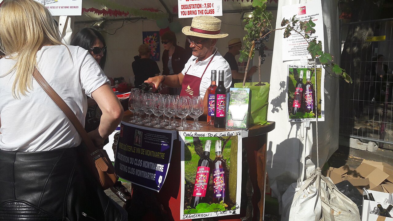 Try some French wine at the Fête des Vendanges in Montmartre, Paris! (Xenophôn via WikiCommons under CC BY-SA 4.0)