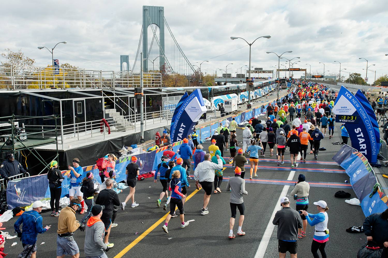 Image of the starting line of the New York City Marathon with the Verrazzano-Narrows Bridge in the background.