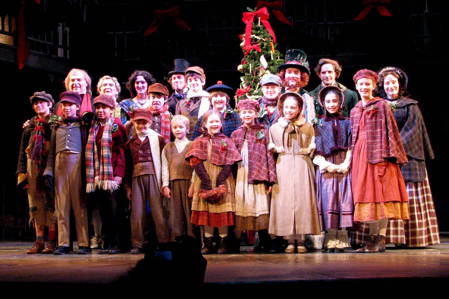 An image of a group of actors performing A Christmas Carol.